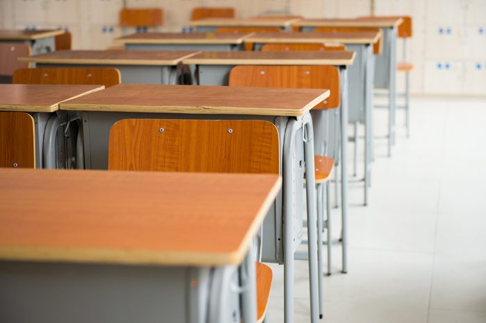 Empty classroom with chairs and desks.