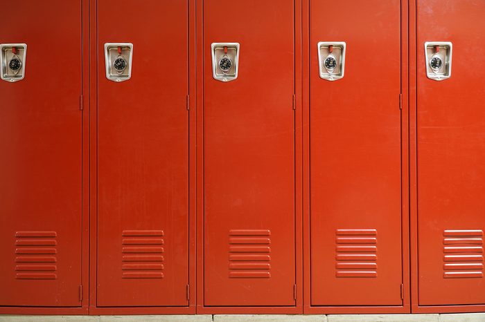 close up on red lockers in gym