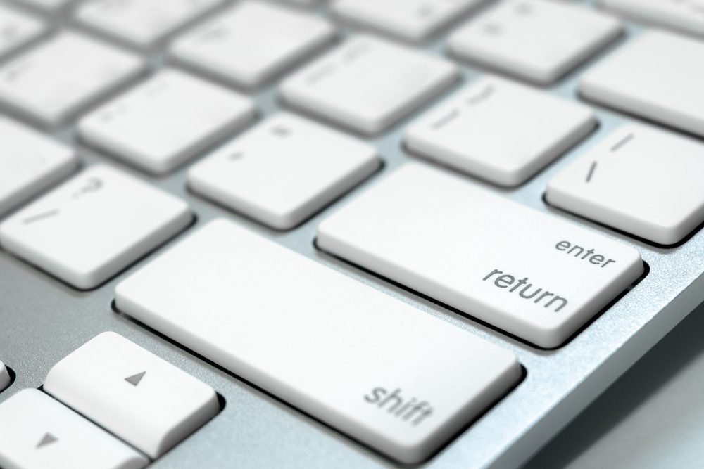 Close up keyboard of a computer on focus at enter button