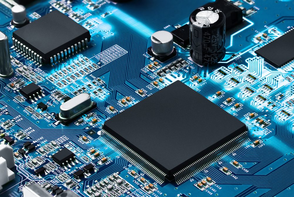 Electronic circuit board with processor, close up.