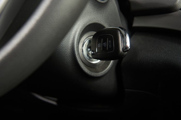 Ignition key of modern car close up. Car key in keyhole