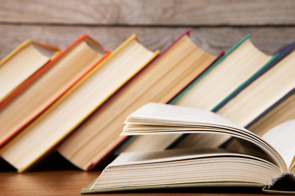 Open book on the wooden background