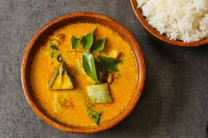 Kerala fish curry cooked in coconut milk, overhead view
