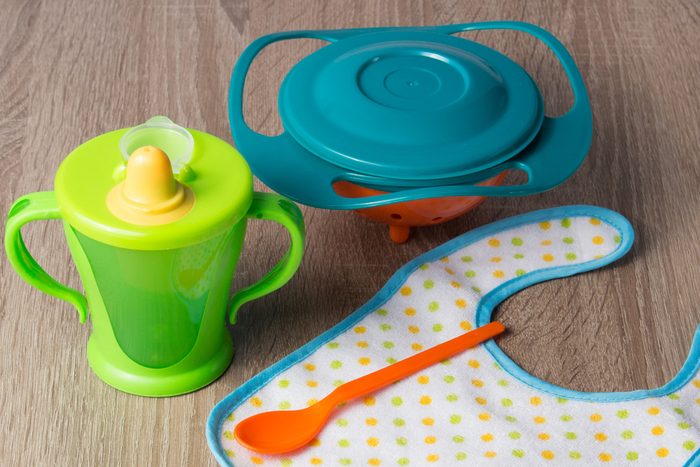 Baby plastic gyro bowl, plastic cup, spoon, bib.