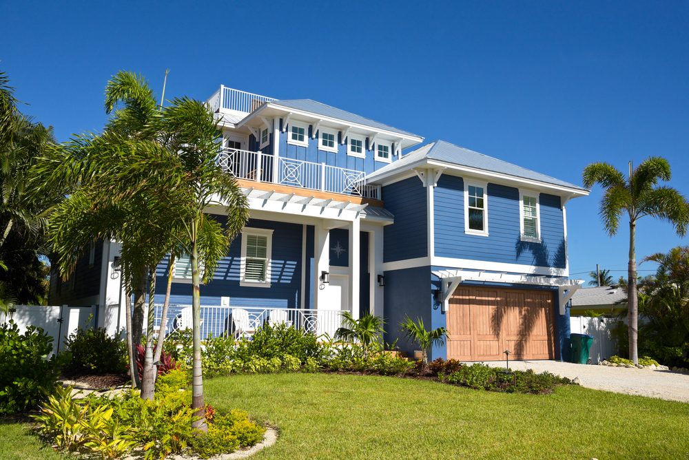 Beautiful New Florida House with Palm Trees and Landscaping