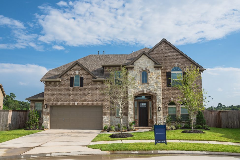 Brand new two story residential house in suburban American neighborhood at Humble, Texas, US. Newly constructed, freshly built modern home with landscaped yard.