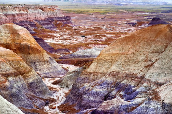 Striped purple sandstone formations of Blue Mesa badlands in Petrified Forest National Park, Arizona, USA