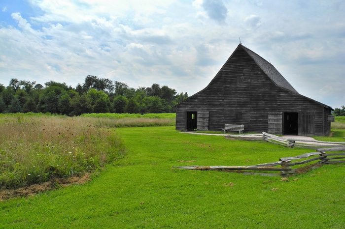 One of the old buildings in Historic St. Mary's City, which was Maryland's (United States of America) first capital city. Time stopped here in 17th century. Green grass and wooden building. Fields.