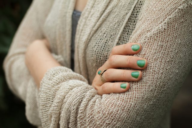 Fold One's Arms. Woman cross arms in wool jacket.