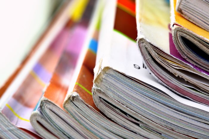 Pile of colorful magazines close up