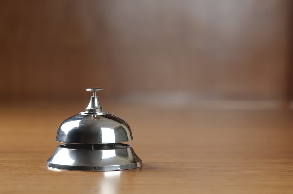 service bell on the hotel reception desk with copy space