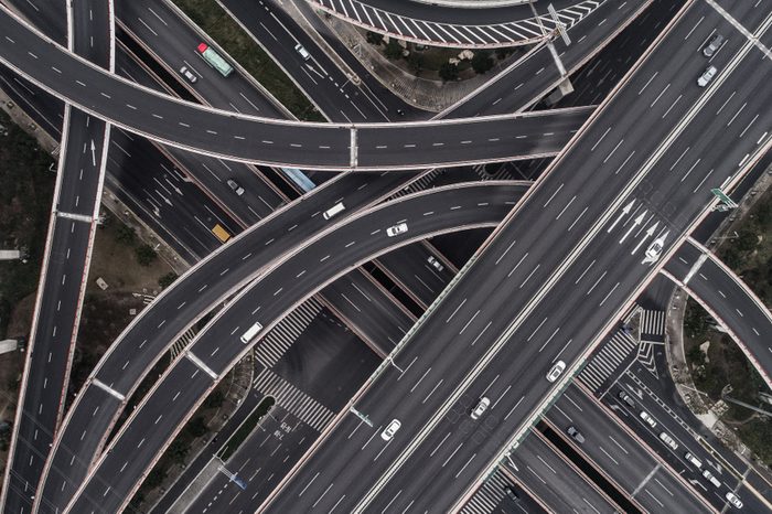 Aerial view of highway and overpass in city on a cloudy day