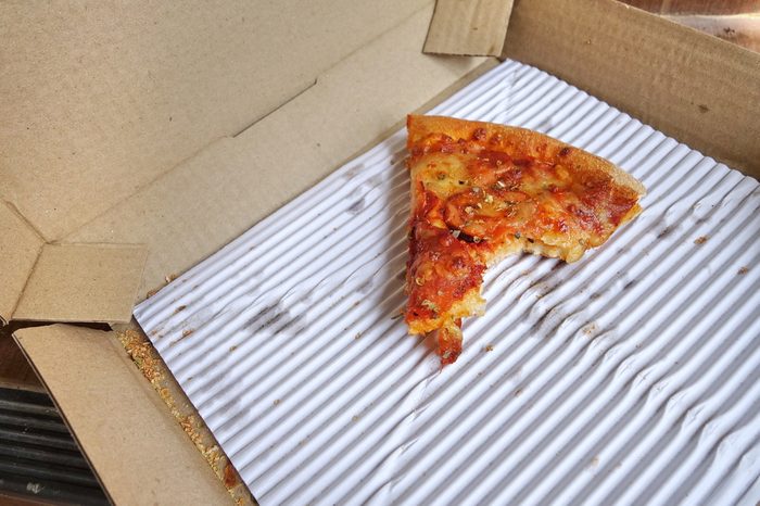 Leftover pizza in box