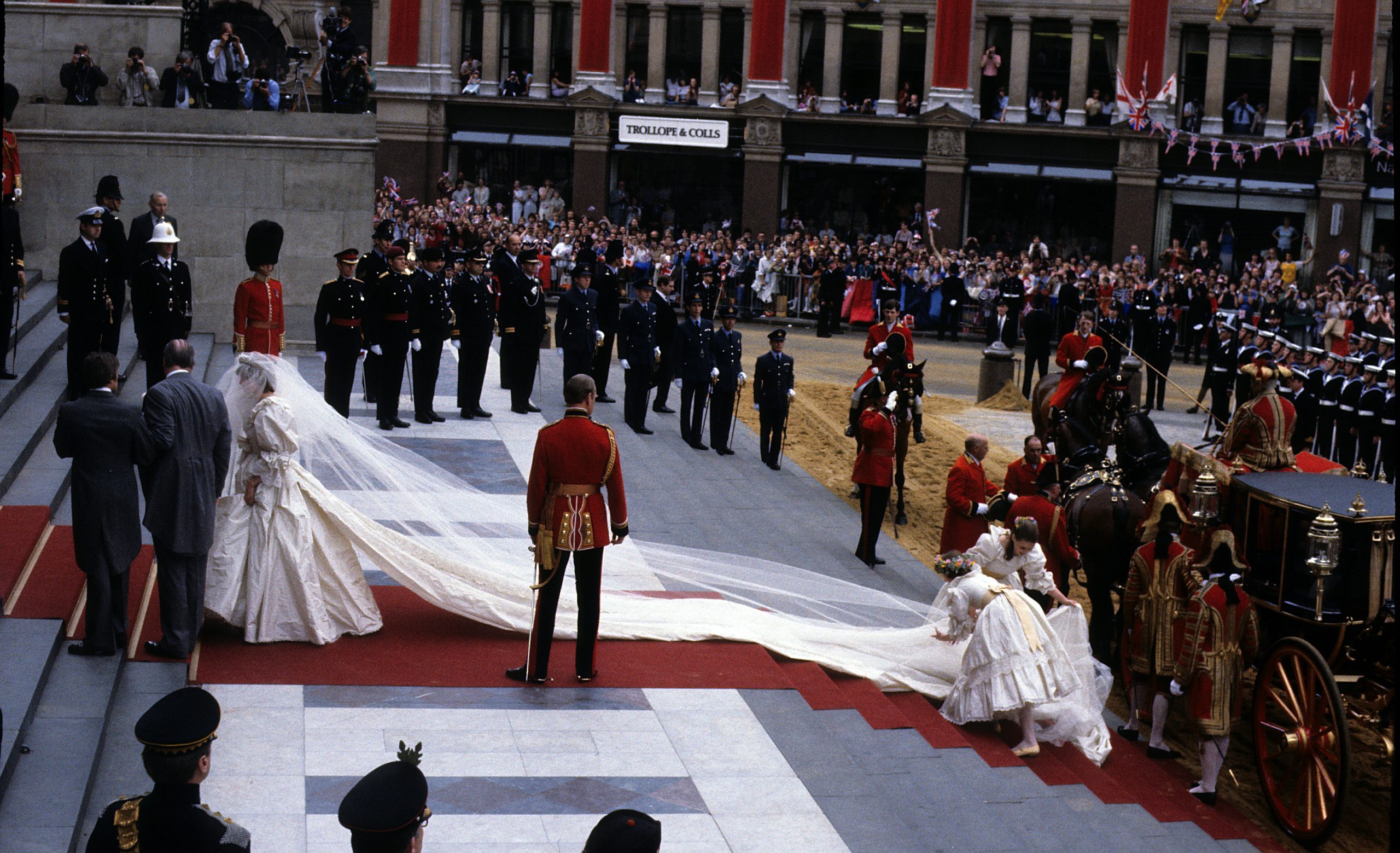 Emanuel and the Spencer family Tiara, prepares to enter St. Paul's Cathedral on the hand of her father, Earl Spencer, with her bridesmaids Lady Sarah Armstrong-Jones and India Hicks