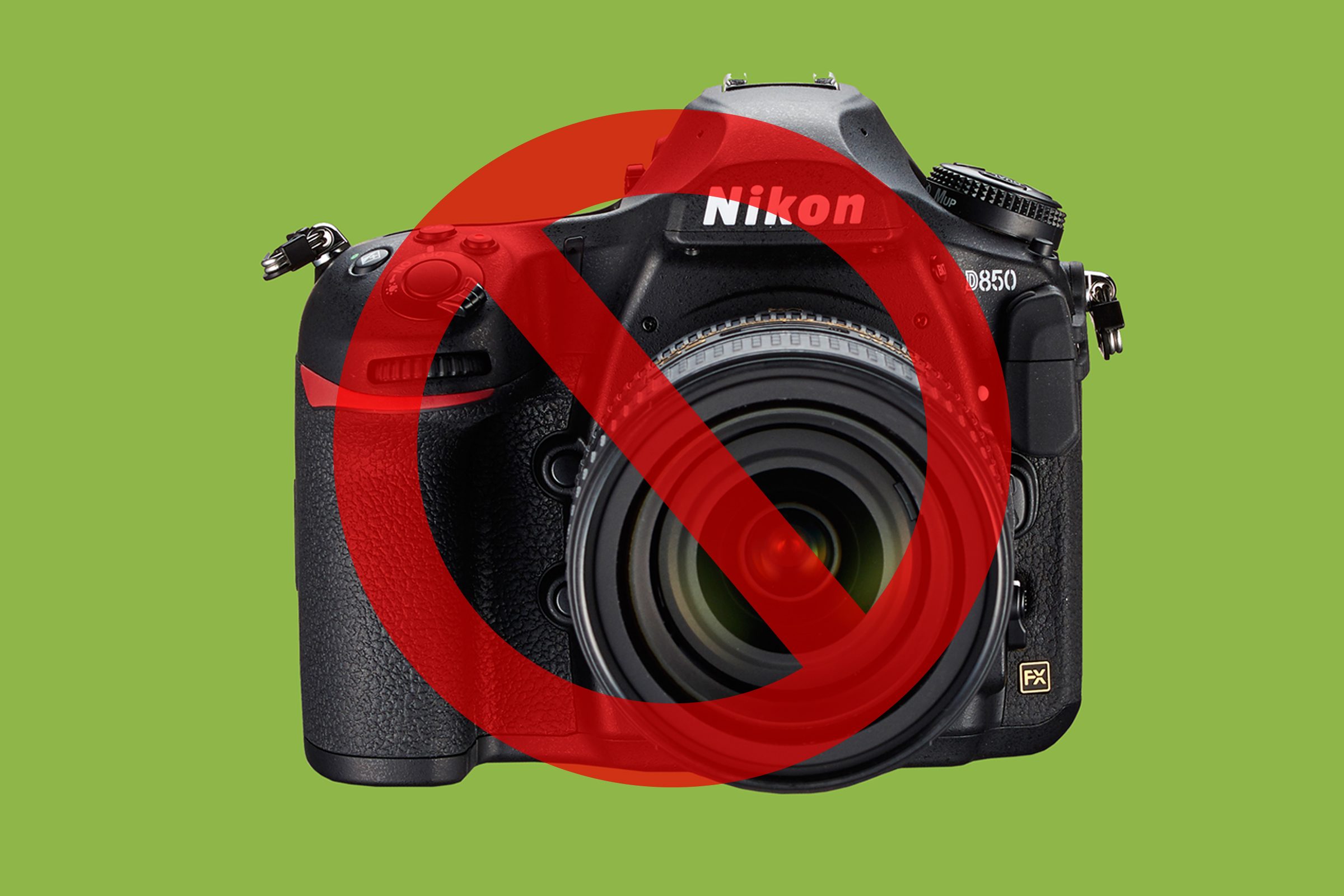 Camera on green background with cancel sign over it 