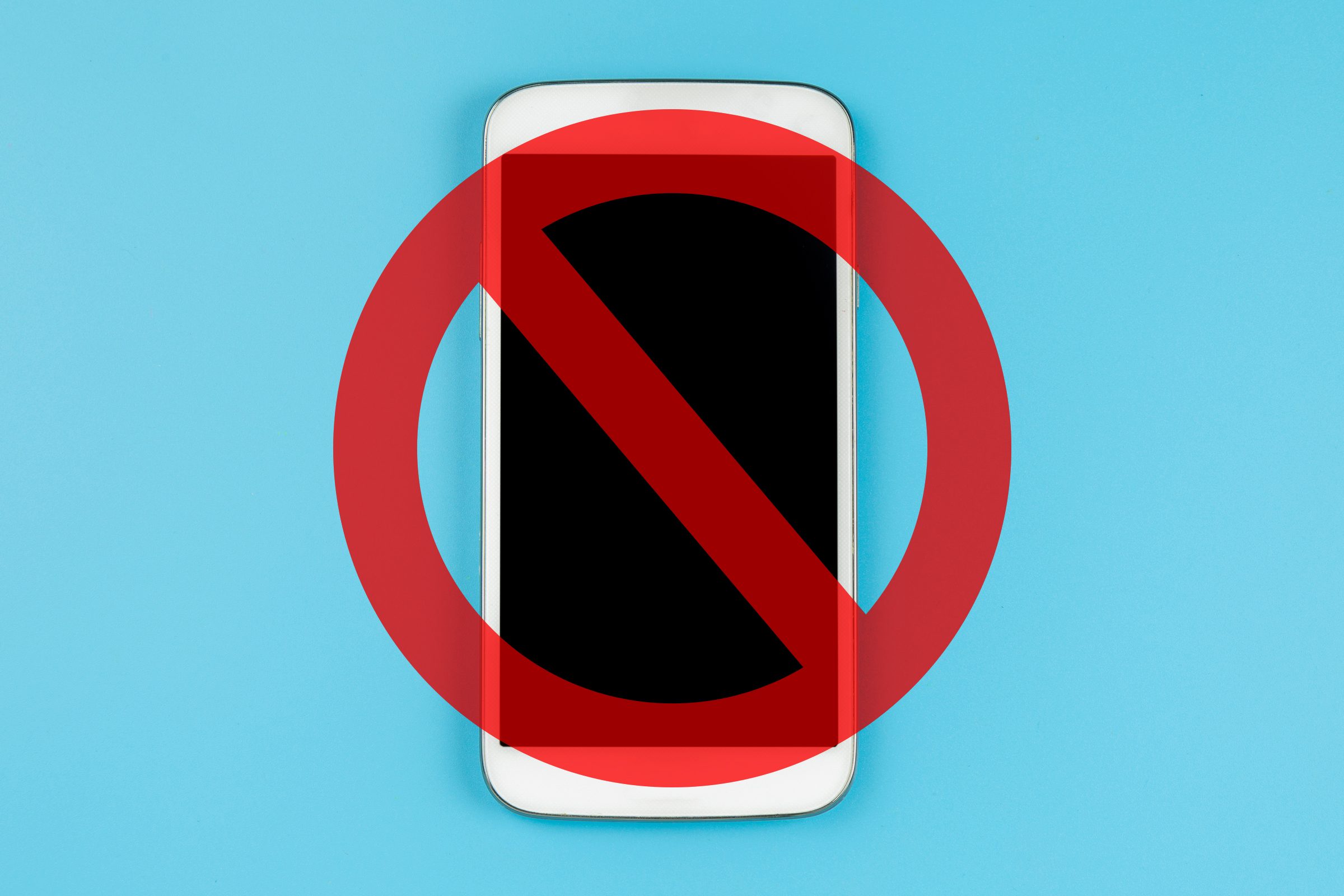 personal cell phone on blue background with a cancel sign over it