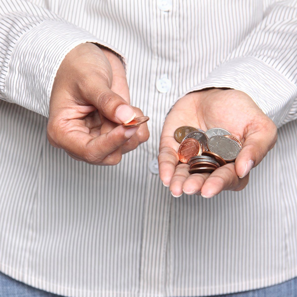 Savings - Business person holding coins