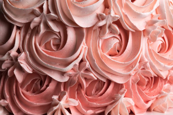 Rose cake icing swirl decoration background pattern. Horizontal.