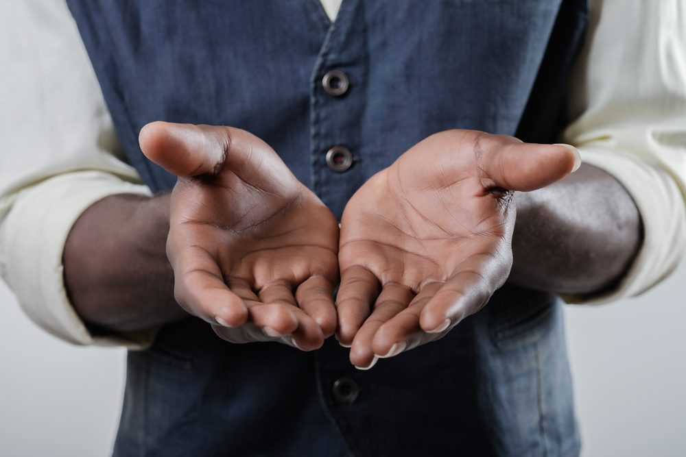 African-American holds open palm