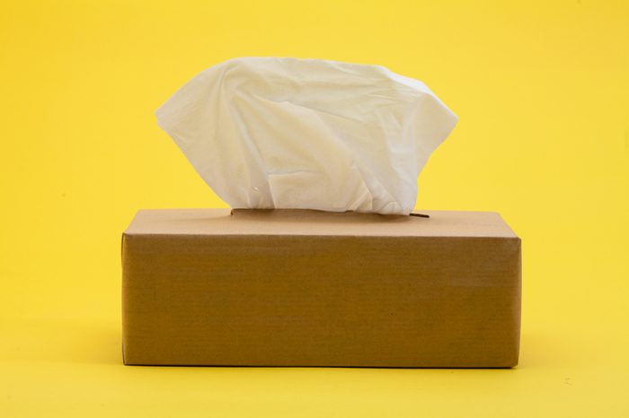 Paper tissues in brown box on yellow background