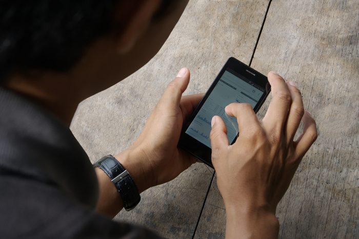 Man touching smartphone