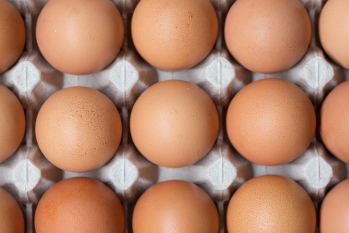 Close up of chicken eggs in package.