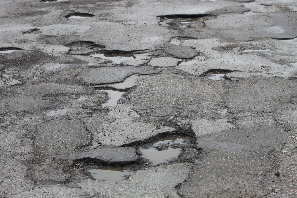 deep potholes in the road make driving hazardous