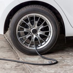 Filling air into a car tire 