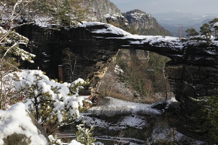 Winter landscape with rock Pravcicka brana in Czech republic