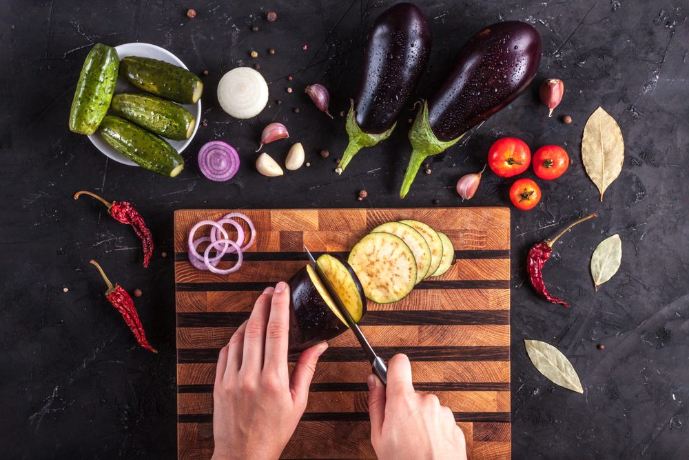 Cut vegetables for cooking eggplant dishes. Top view, fresh vegetables.