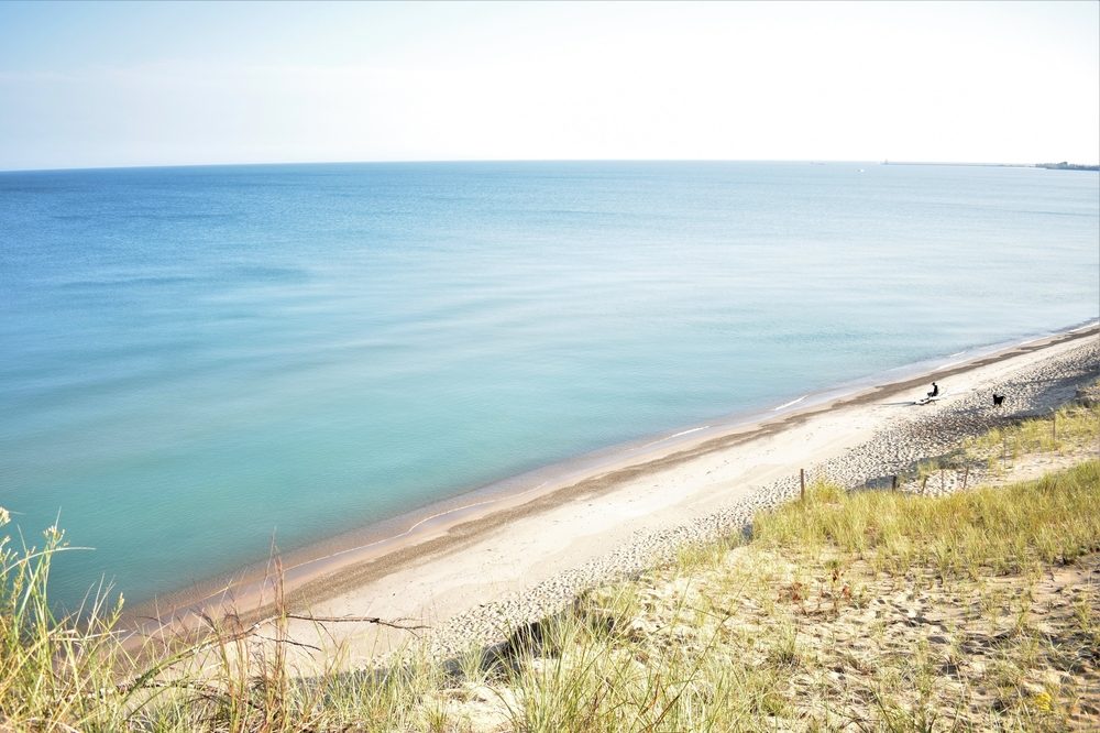 From the top of the Mount Baldy west dune trail, gaze upon the expanse of the great southern Lake Michigan shoreline in Indiana Dunes National Lakeshore Park in Indiana.