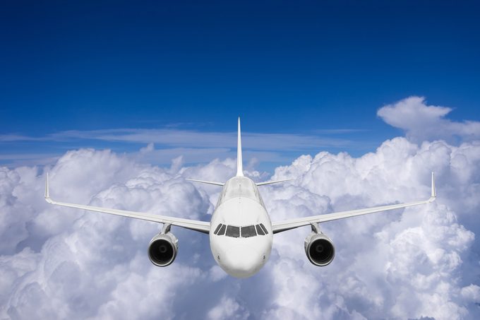 Airplane flying high above the clouds.