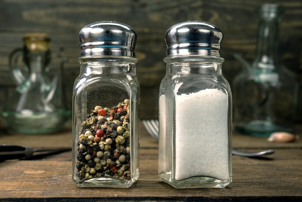 salt and pepper shaker on wooden board