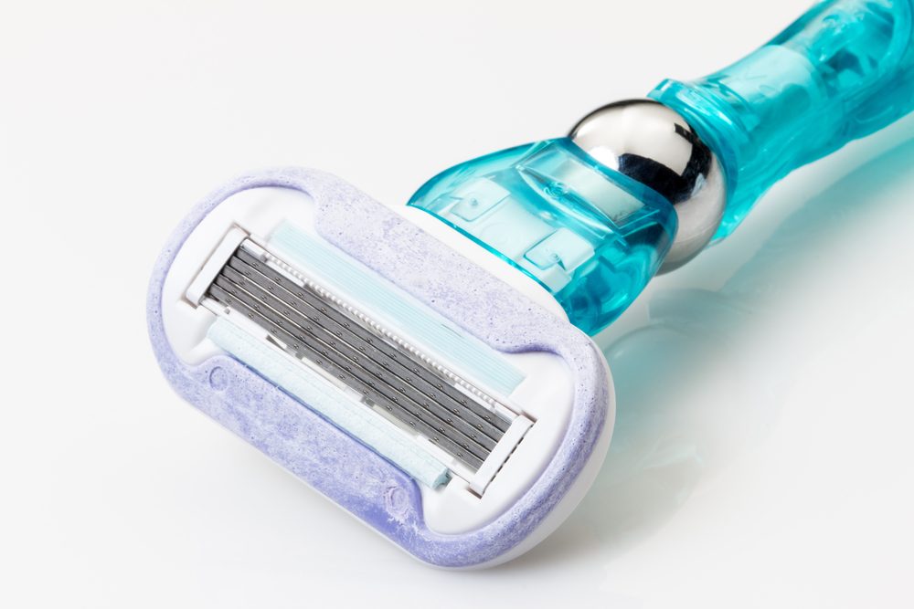 Women's razor on a white background