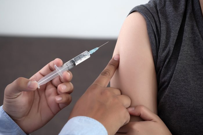 Medicine and health care concept Doctor giving patient vaccine insulin or vaccination