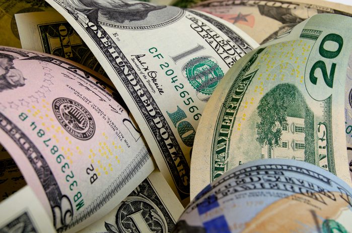 Cash dollars in various denominations on the plane.