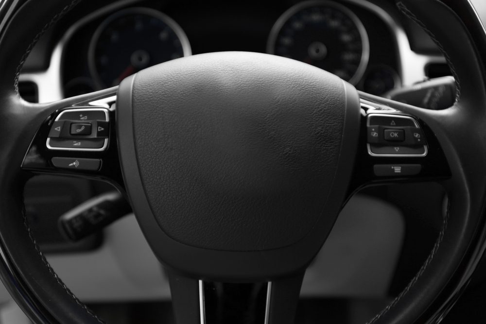 Modern car illuminated dashboard and steering wheel