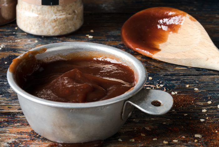 BBQ sauce in vintage measuring spoon
