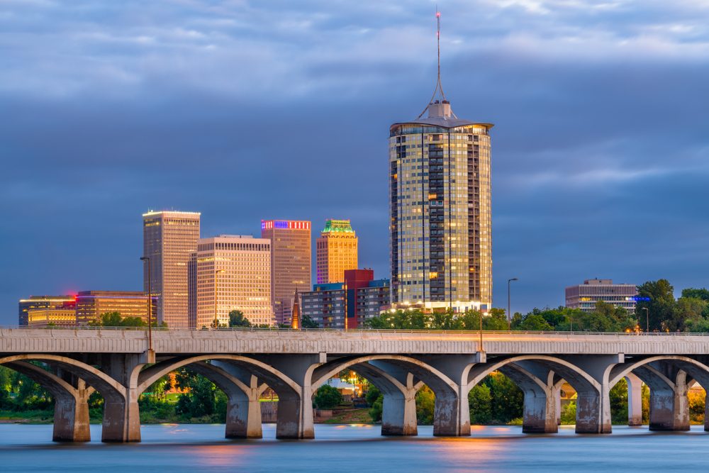Tulsa, Oklahoma, USA downtown skyline on the Arkansas River at dusk.