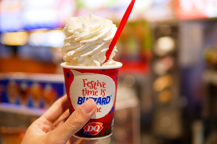 BANGKOK, THAILAND - DECEMBER 21, 2017: Dairy Queen at Siam Center branch in Bangkok, Thailand serve the blizzard ice cream caramel almond with whipped cream topping.