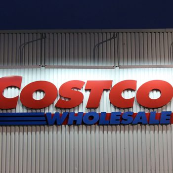 ETOBICOKE, CANADA - DECEMBER 18: Costco Wholesale sign on December 18, 2013 in Etobicoke, Ontario, Canada. Costco operates a chain of membership warehouses, carrying merchandise at lower prices.