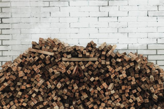 Preparation of firewood for the winter. firewood background, Stacks of firewood in the forest