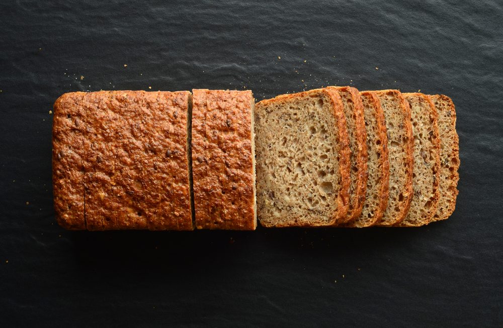 Whole wheat bread on a black stone plate