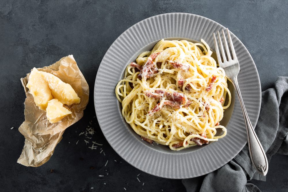 Carbonara pasta, spaghetti with pancetta, egg, hard parmesan cheese and cream sauce. Traditional italian cuisine. Pasta alla carbonara