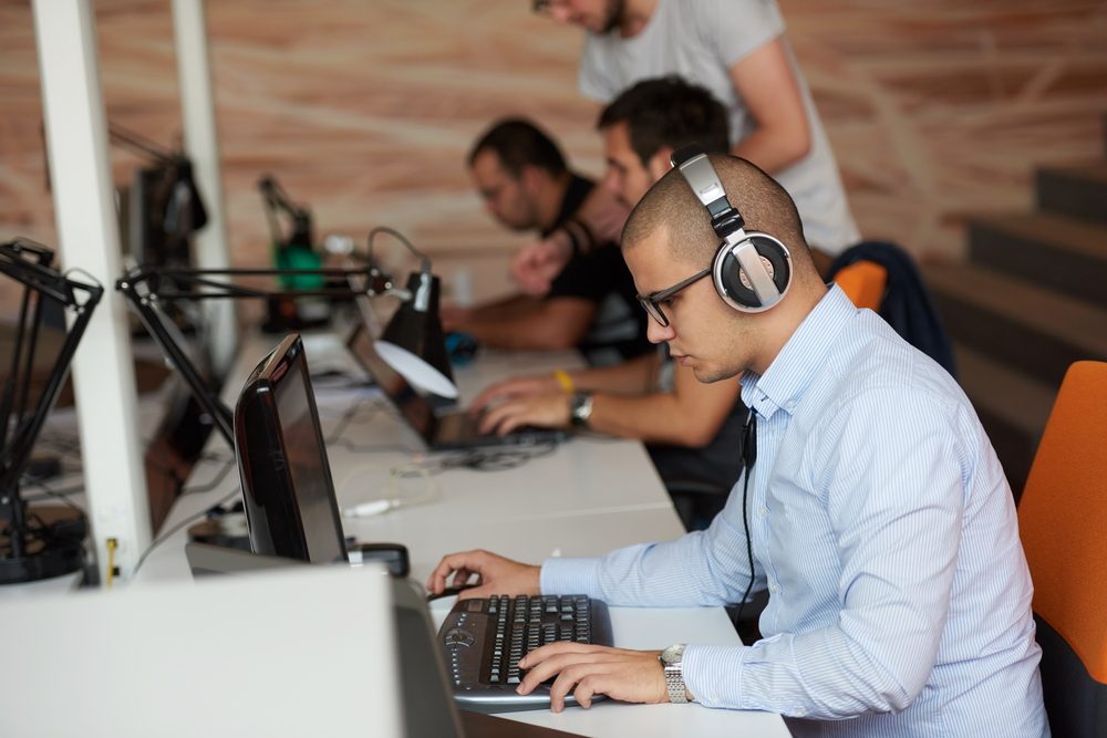 startup business, software developer working on computer at modern office