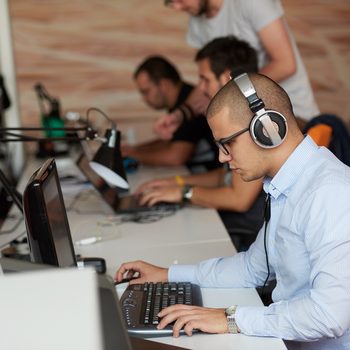 startup business, software developer working on computer at modern office