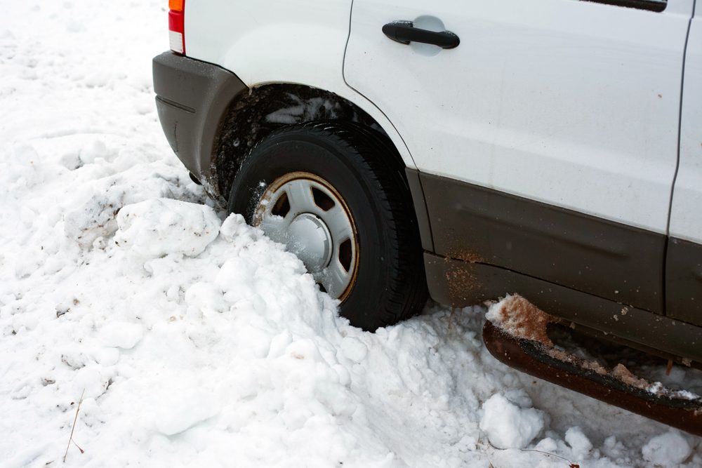 a tired buried deeply in the snow