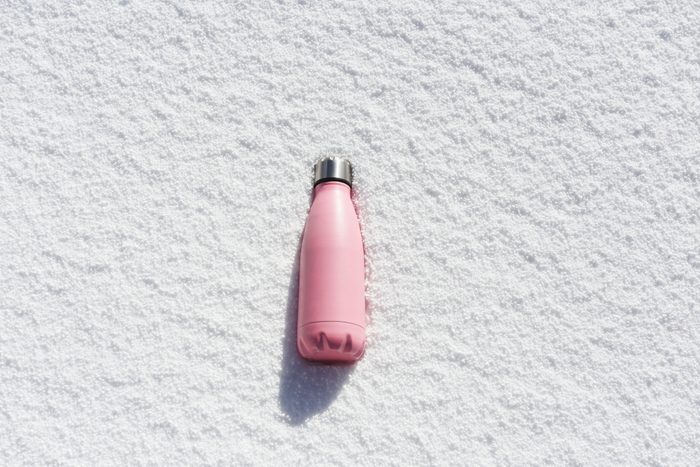 Thermos bottle on the snow