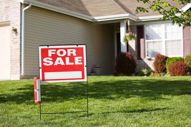 Real Estate: For Sale Sign In Front Of House