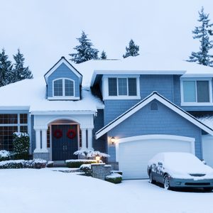 Fresh blanket of snow on residential home during the winter holidays.